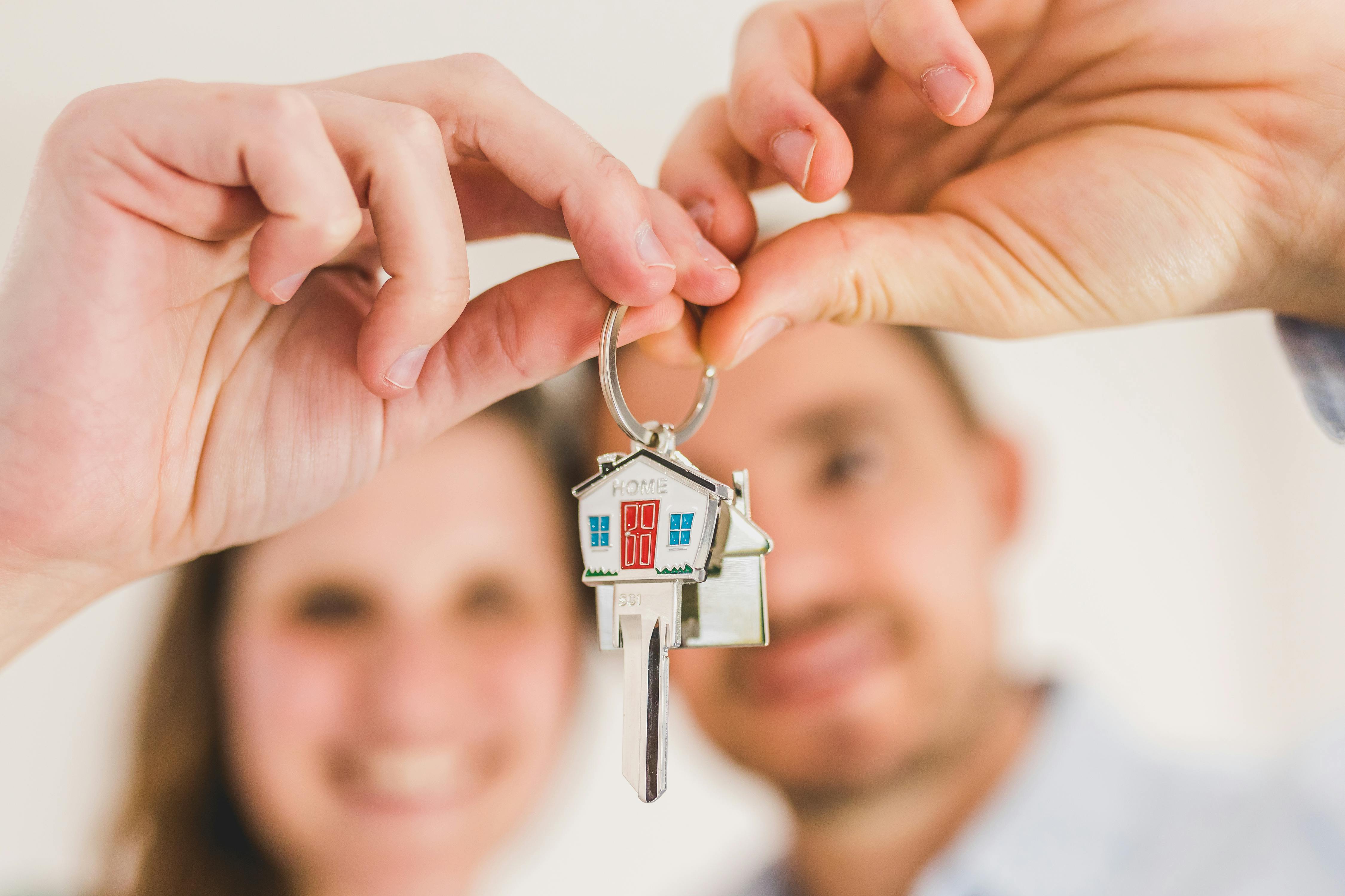 Couple with house-shaped key