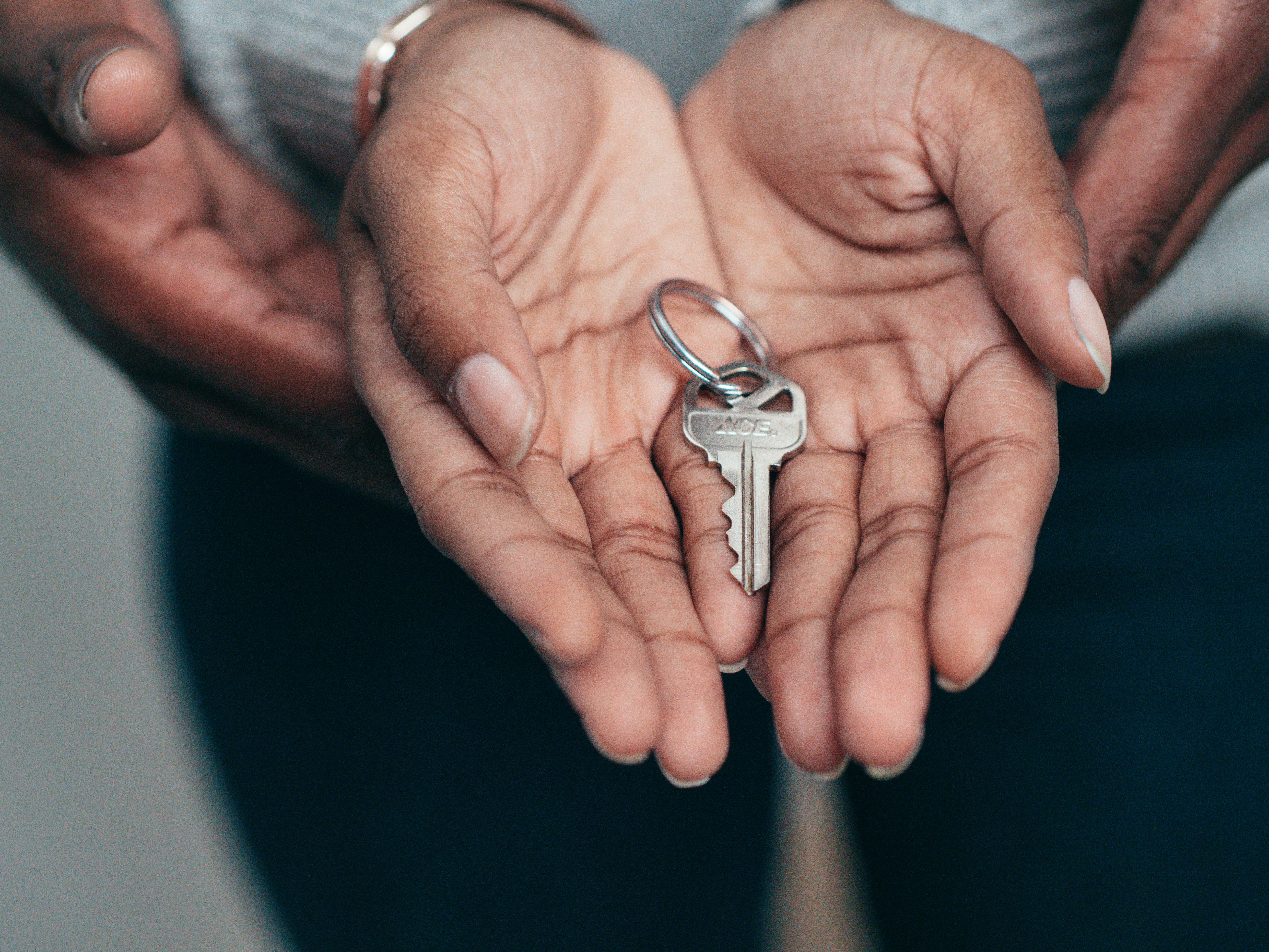 Hands holding a key