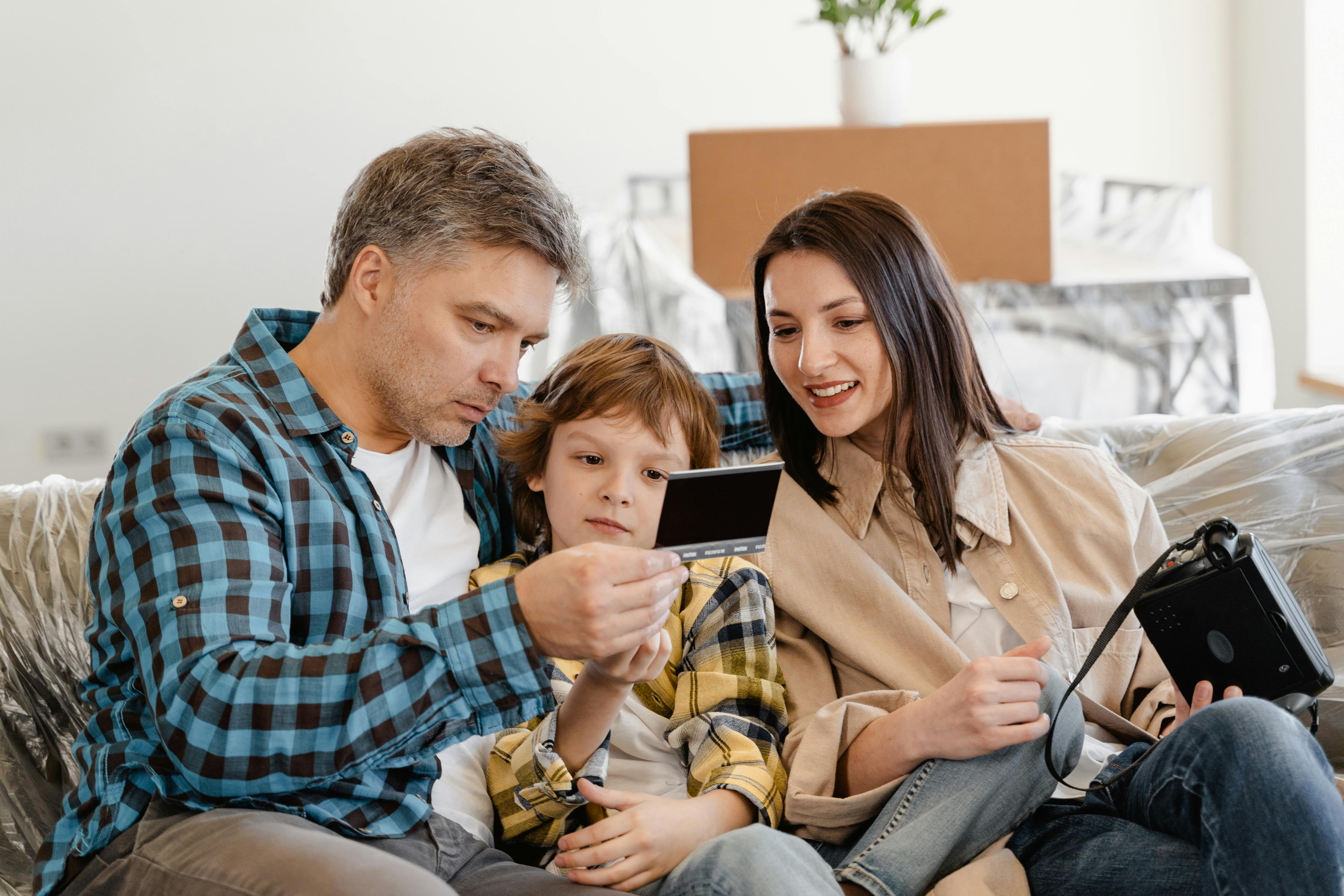 Family on couch with photo