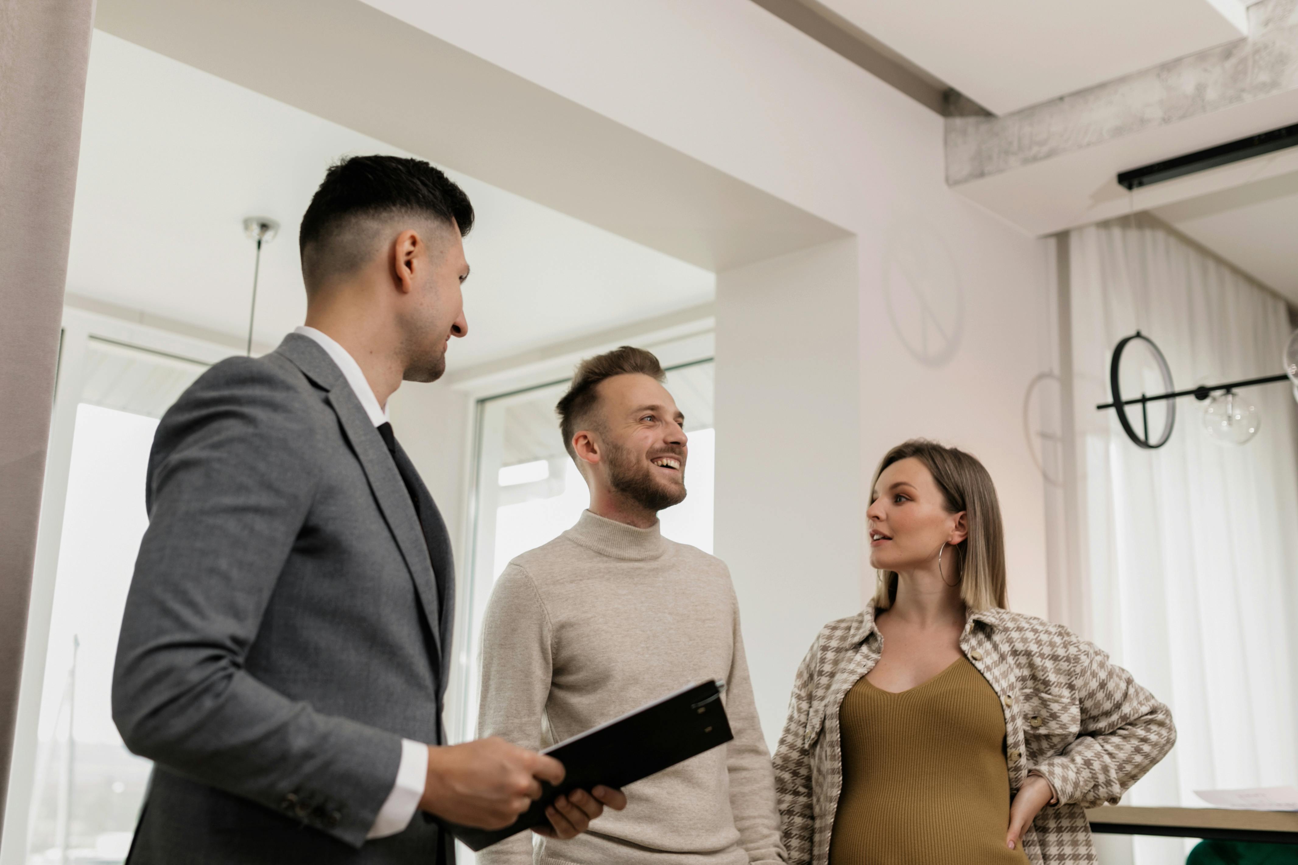 Couple consulting with real estate agent