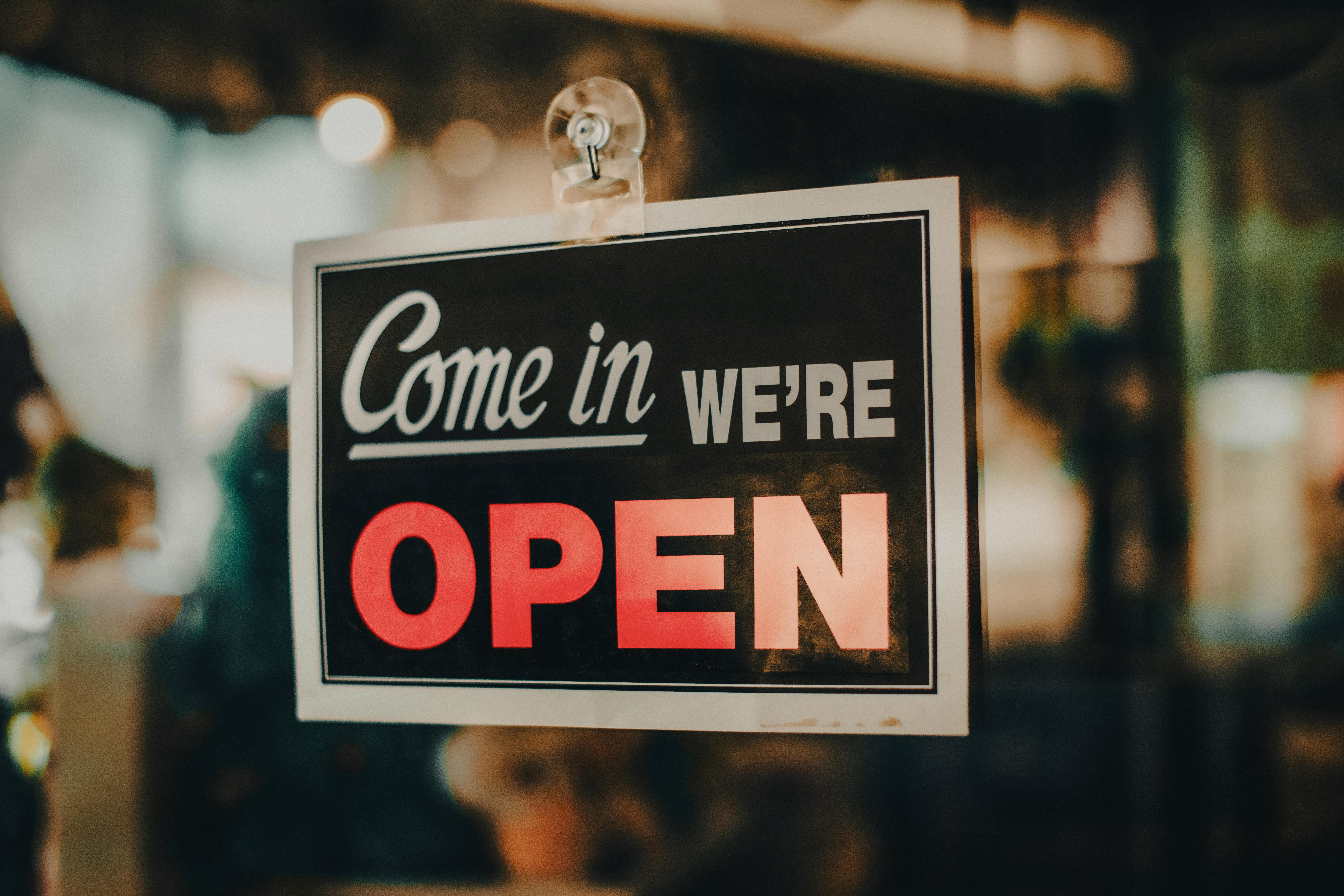 Charming open sign displayed at a shop