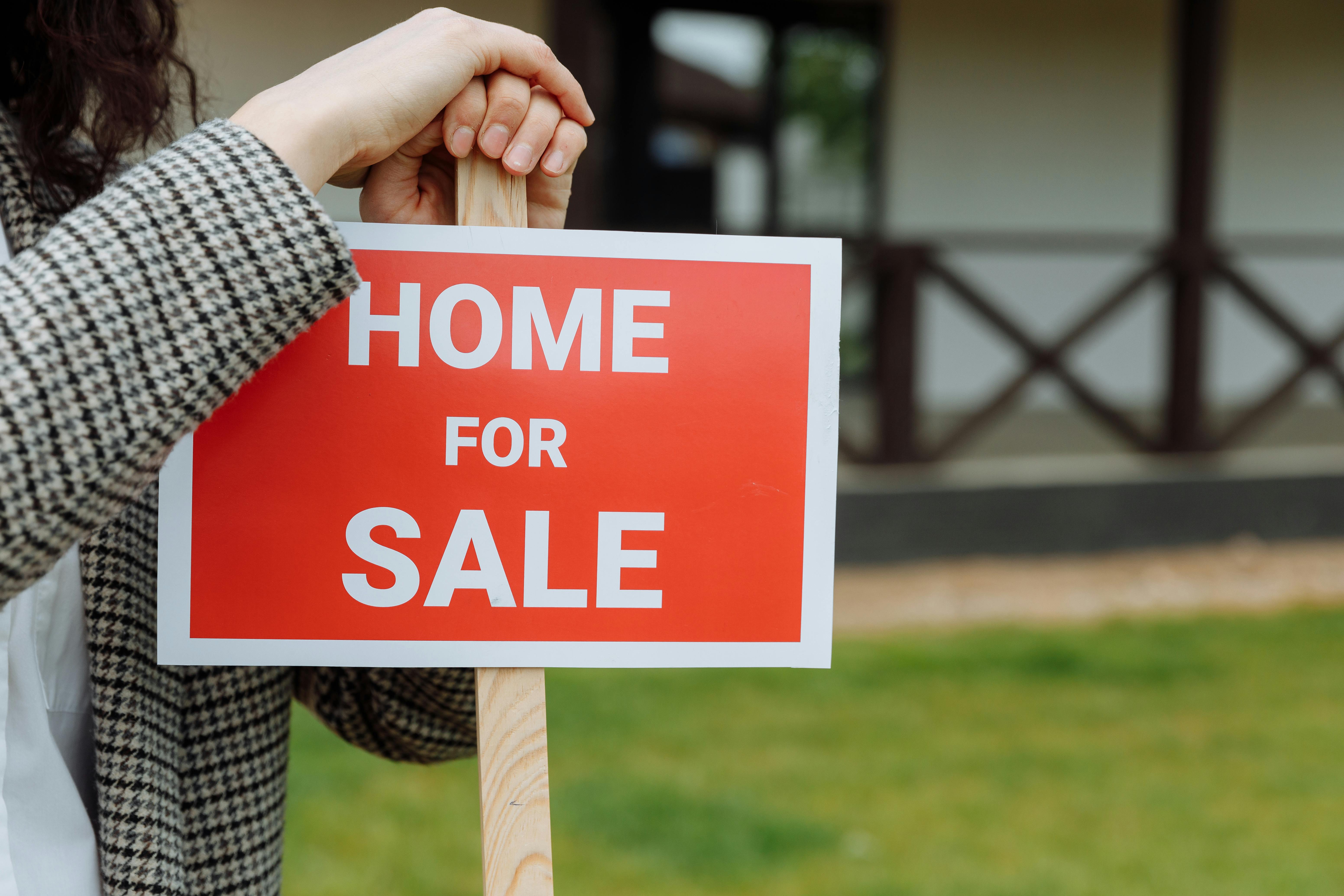 Home for Sale Sign Outdoors