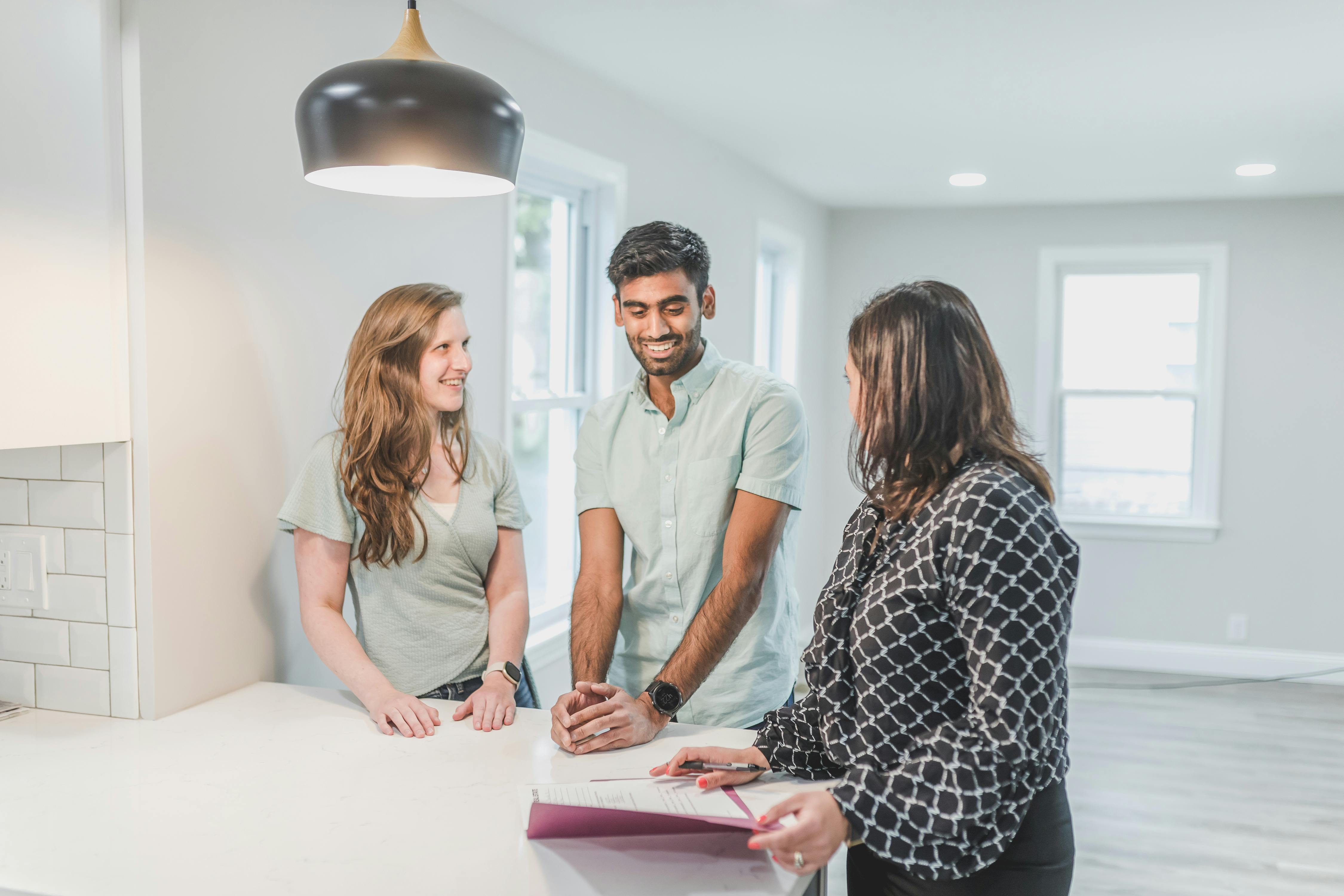 Real estate agent consulting a couple