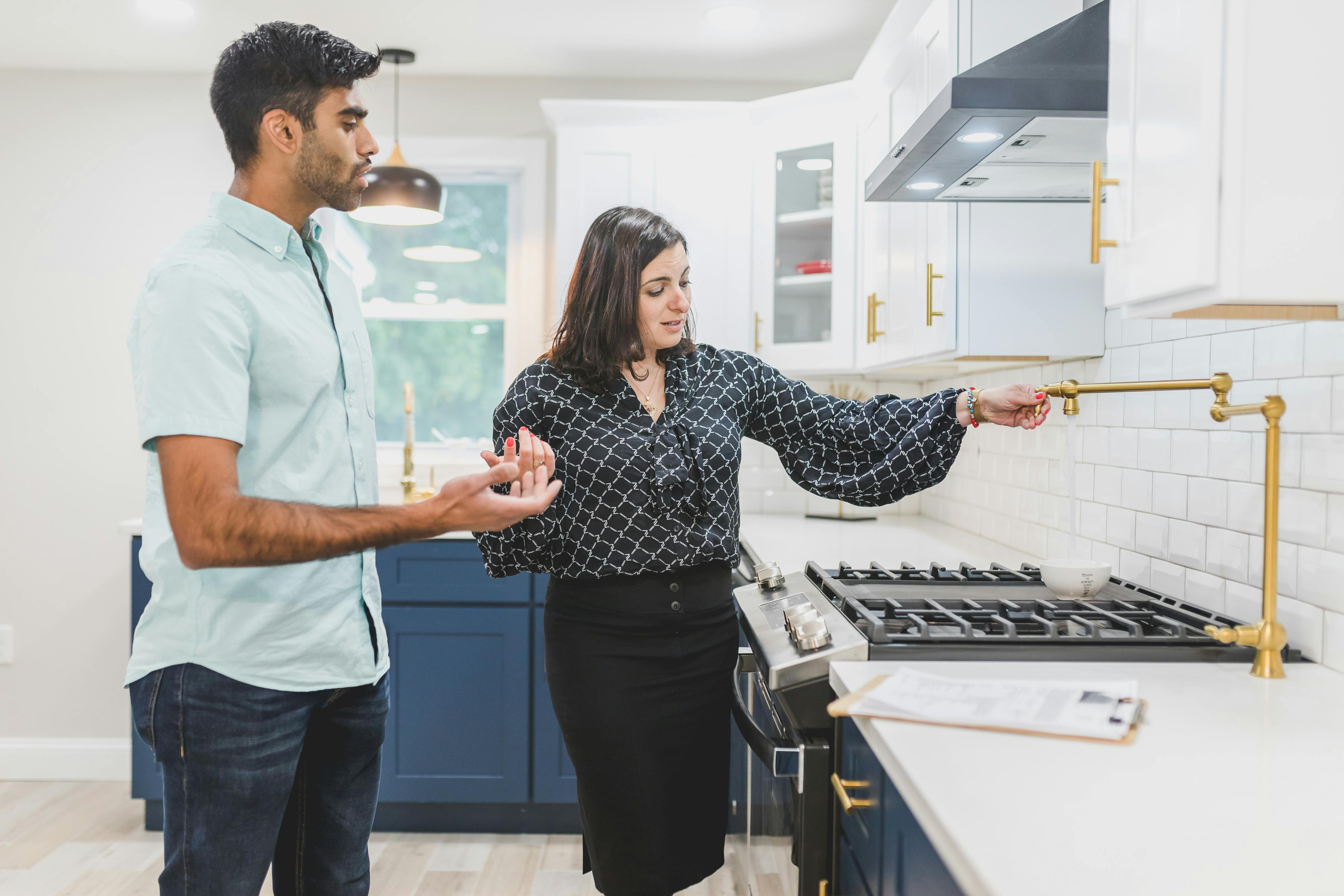 Agent Showing Kitchen